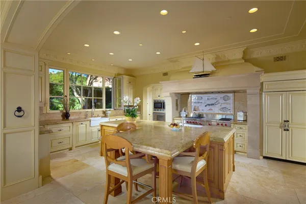 a view of a patio with couches table and chairs with wooden floor