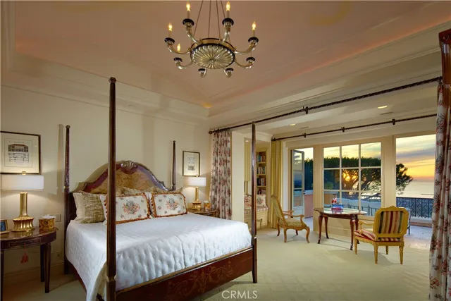 a front view of a house with a garden and trees