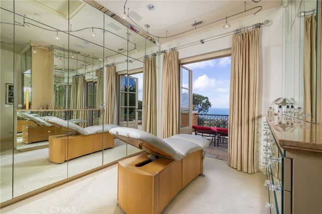 an aerial view of a houses with a lake