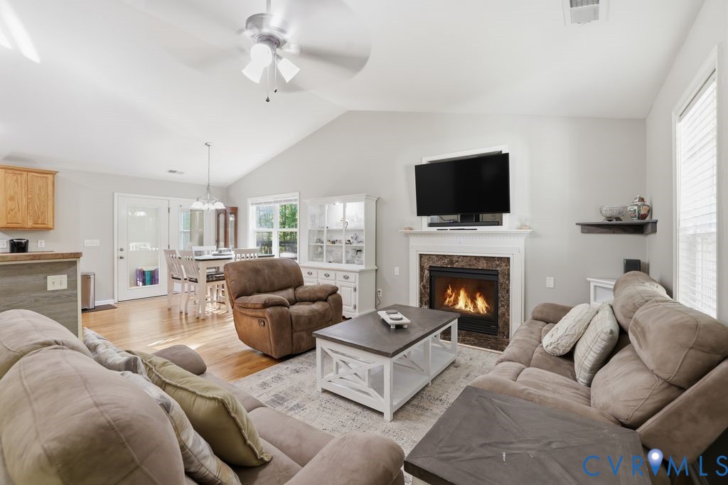 5307 St Pauls Church Road Goochland, VA 23063 - Photo 10 of 44 a living room with furniture a flat screen tv and a fireplace