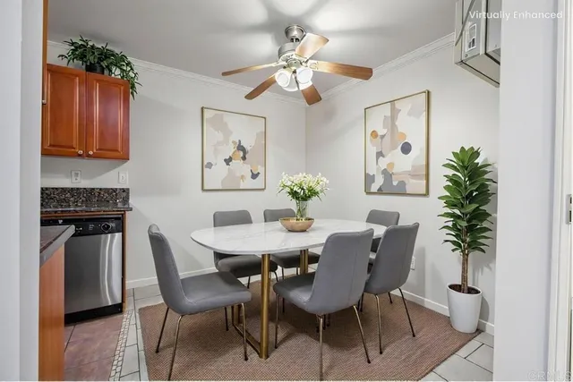 a dining room with furniture potted plants and wooden floor