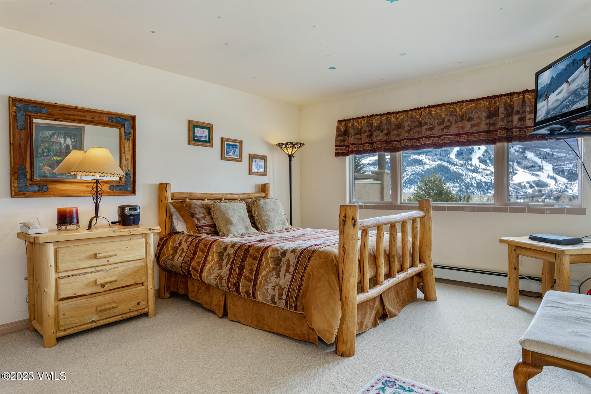 751 Singletree Road, Unit 1 Edwards, CO 81632 - Photo 11 of 16 a spacious bedroom with a bed and a window