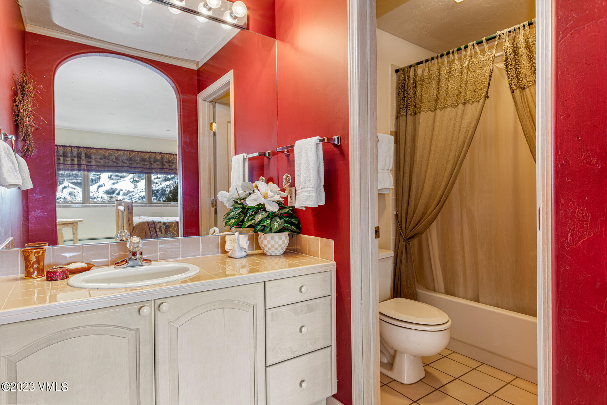 751 Singletree Road, Unit 1 Edwards, CO 81632 - Photo 12 of 16 a bathroom with a sink a mirror and a shower curtain