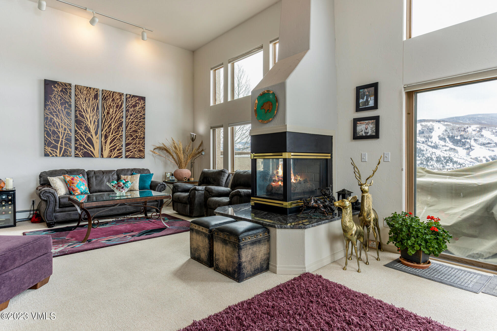 751 Singletree Road, Unit 1 Edwards, CO 81632 - Photo 5 of 16 a living room with furniture a fireplace and a flat screen tv