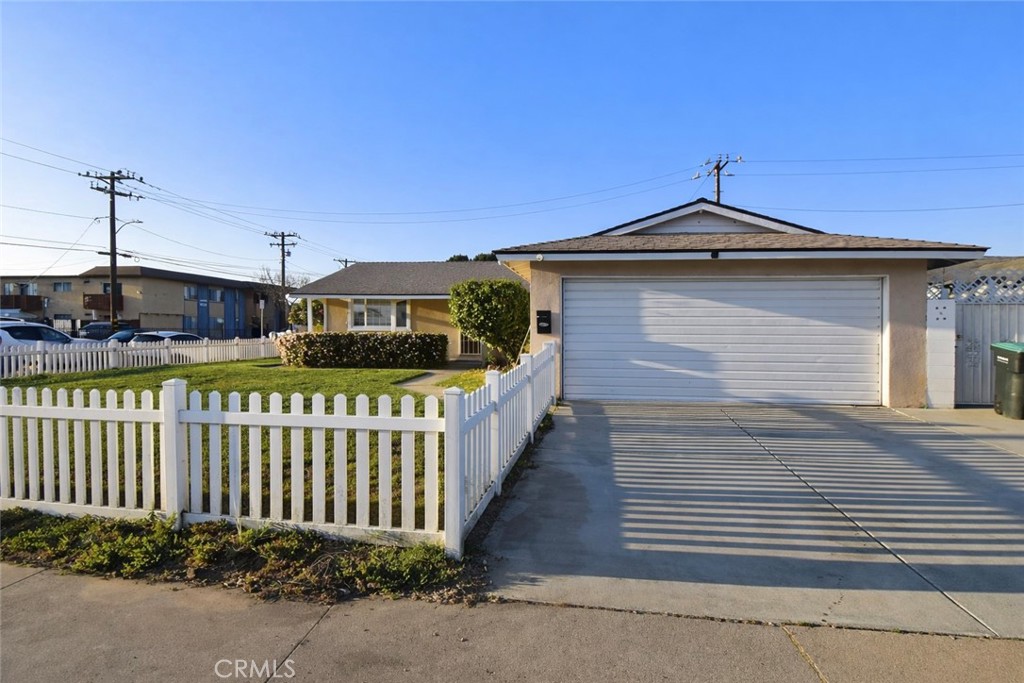 7251 Middlesex Drive Stanton, CA 90680 - Photo 1 of 11 a front view of a house with wooden fence