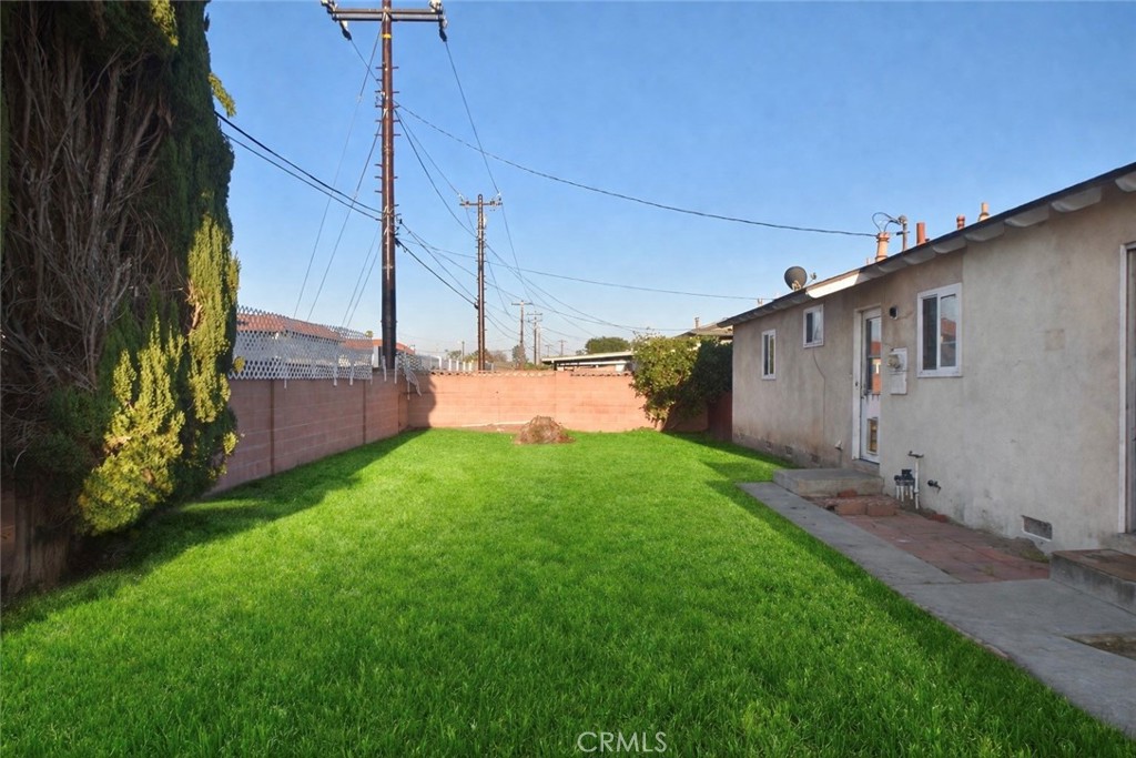 7251 Middlesex Drive Stanton, CA 90680 - Photo 11 of 11 a view of a backyard with plants and a garden