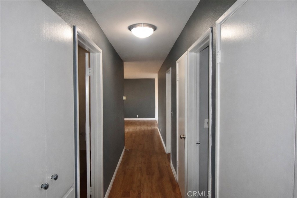 7251 Middlesex Drive Stanton, CA 90680 - Photo 5 of 11 a view of a hallway with wooden floor