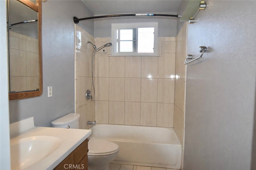 7251 Middlesex Drive Stanton, CA 90680 - Photo 8 of 11 a bathroom with a sink a toilet and shower