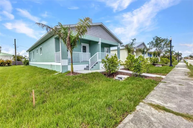 a kitchen with a refrigerator and a stove top oven
