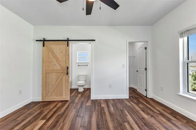 a kitchen with kitchen island a refrigerator sink and cabinets