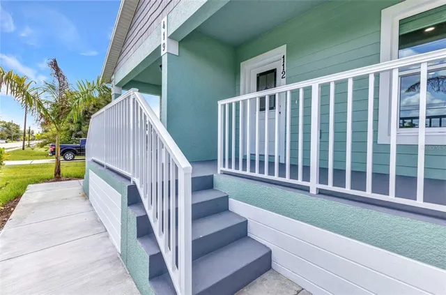 a kitchen with kitchen island a refrigerator sink and microwave
