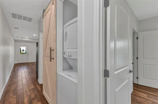 an aerial view of residential houses with outdoor space and swimming pool