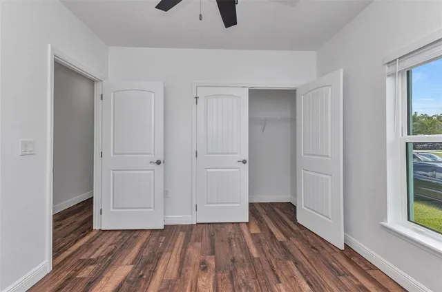an aerial view of residential houses with outdoor space and swimming pool