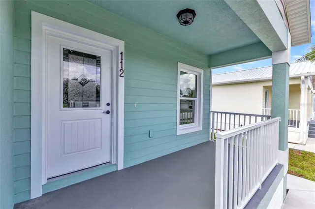 a kitchen with stainless steel appliances granite countertop a sink stove microwave and refrigerator