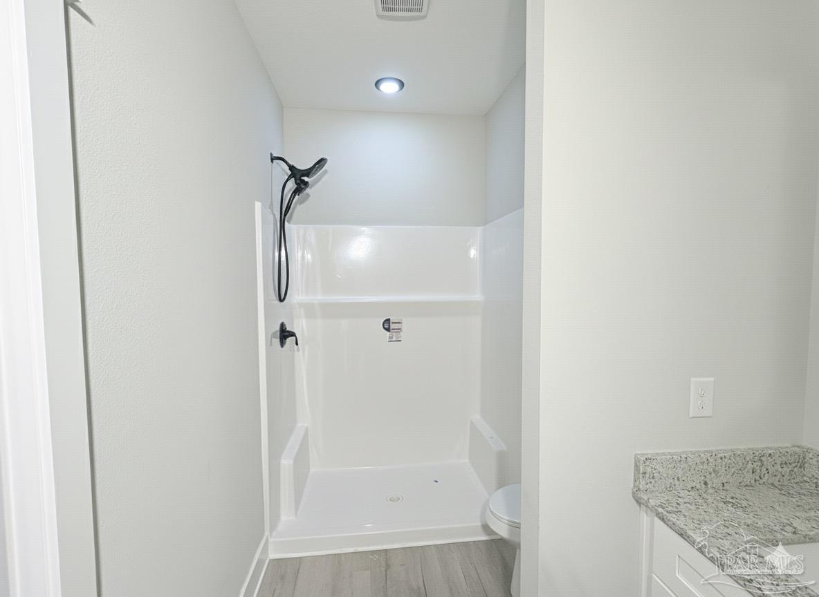2936 North 14th Avenue Milton, FL 32583 - Photo 14 of 23 a bathroom with a granite countertop shower and a sink