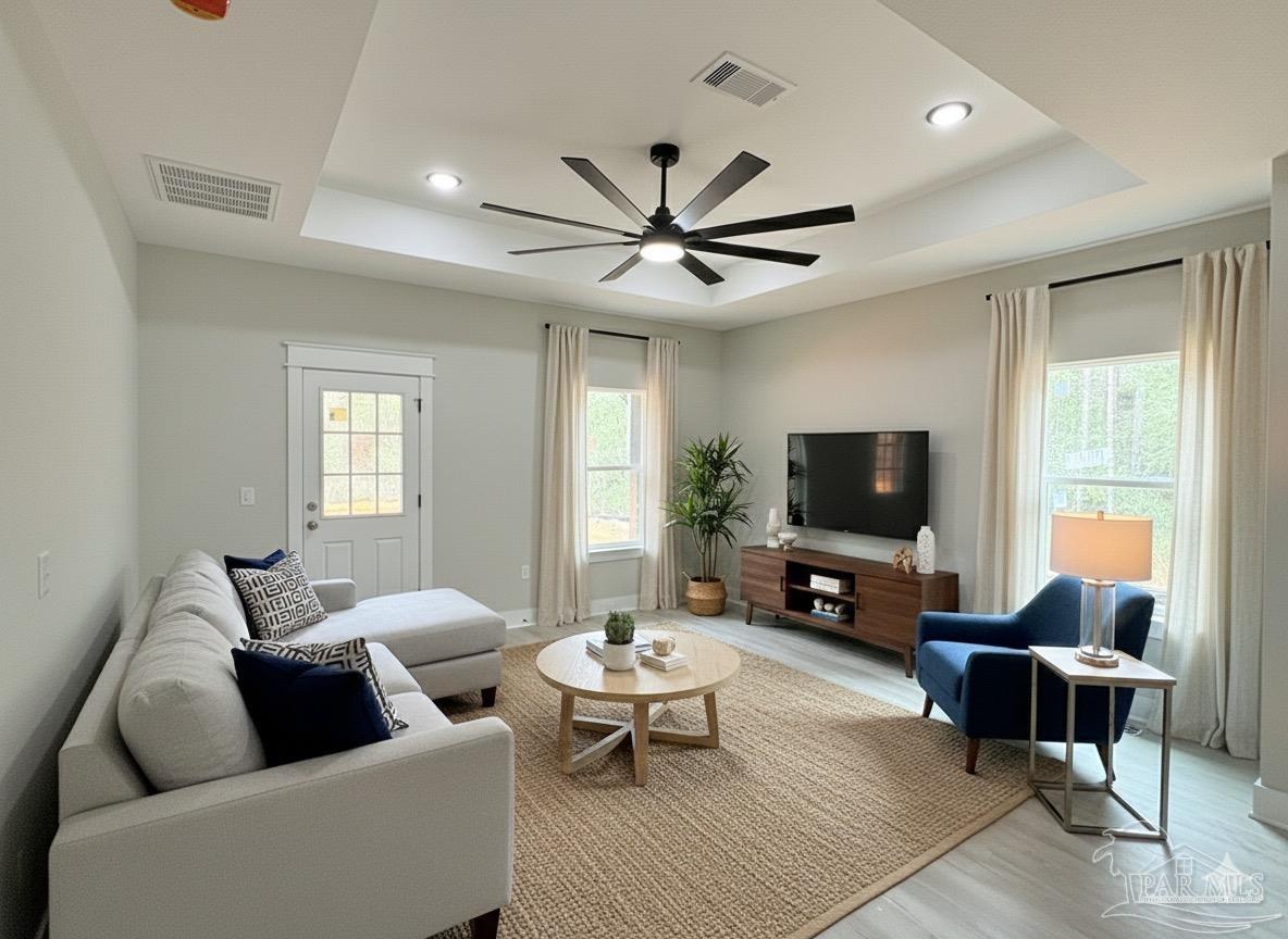 2936 North 14th Avenue Milton, FL 32583 - Photo 4 of 23 a living room with furniture and a flat screen tv