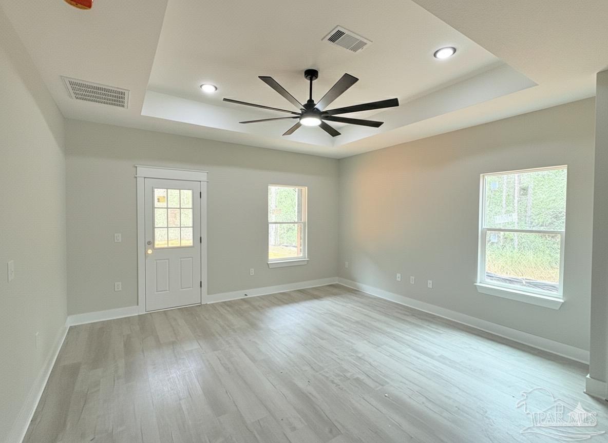 2936 North 14th Avenue Milton, FL 32583 - Photo 5 of 23 a view of an empty room with window and wooden floor