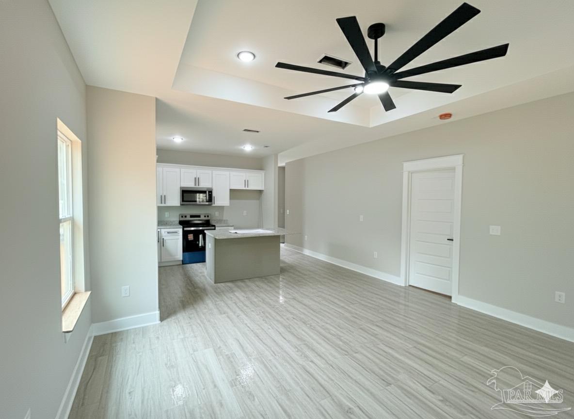 2936 North 14th Avenue Milton, FL 32583 - Photo 6 of 23 a view of kitchen with stainless steel appliances wooden floor
