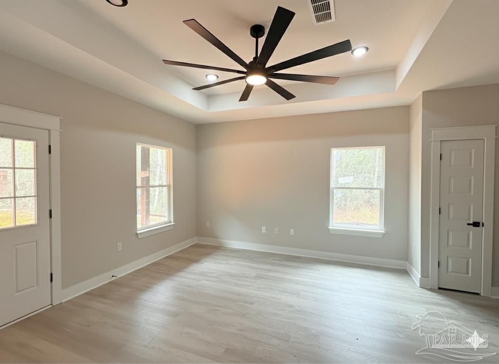 2936 North 14th Avenue Milton, FL 32583 - Photo 7 of 23 a view of an empty room with a window and wooden floor