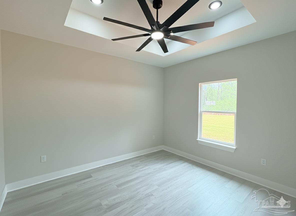 2936 North 14th Avenue Milton, FL 32583 - Photo 9 of 23 an empty room with a window and a fan