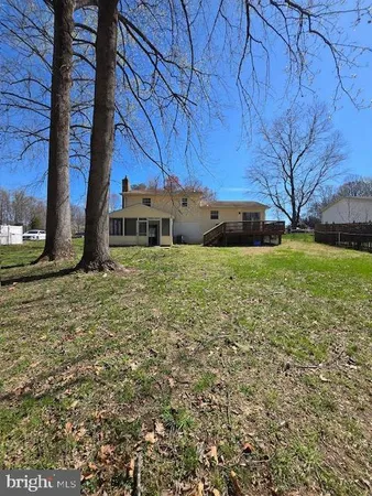 a view of a backyard of the house