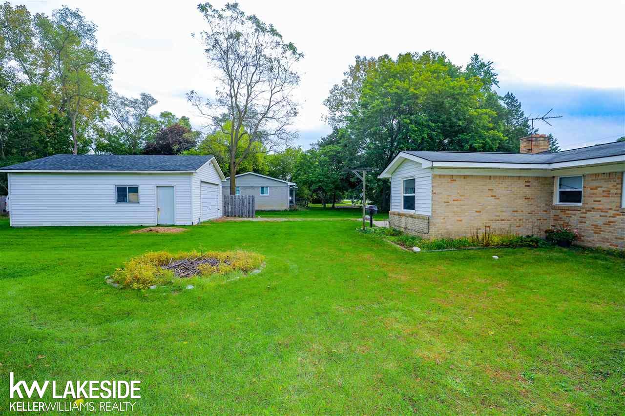 1515 East Hamlin Road Rochester, MI 48307 - Photo 29 of 31 Backyard is perfect for adding a dog run, and the oversized garage is ideal for mechanics, woodworkers or business owner needing to store equipment.
