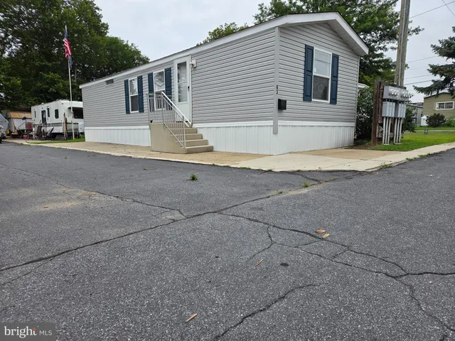 a view of a house with a street