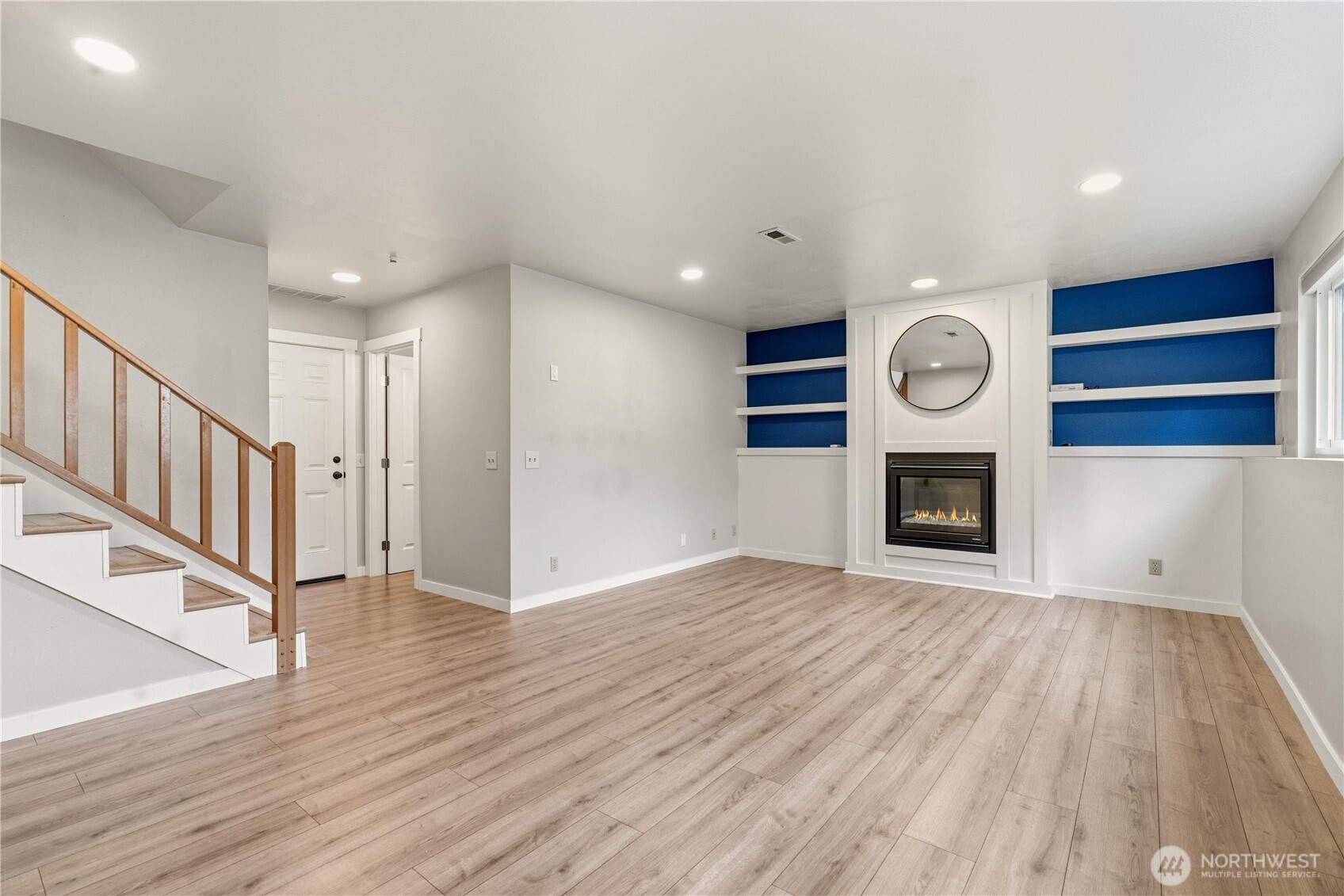 2401 185th Place Southeast Bothell, WA 98012 - Photo 11 of 36 a view of an empty room with wooden floor and a window