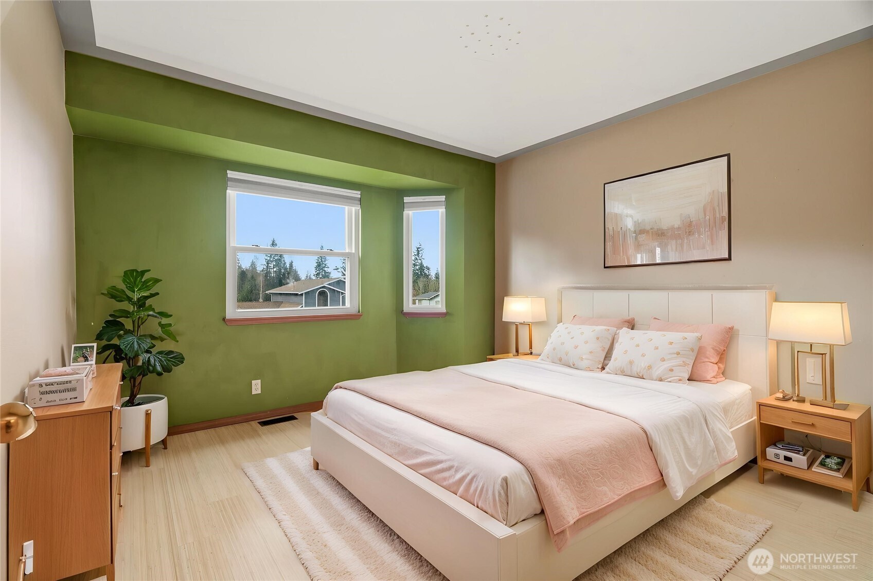 2401 185th Place Southeast Bothell, WA 98012 - Photo 26 of 36 a bedroom with a bed and a painting on the wall