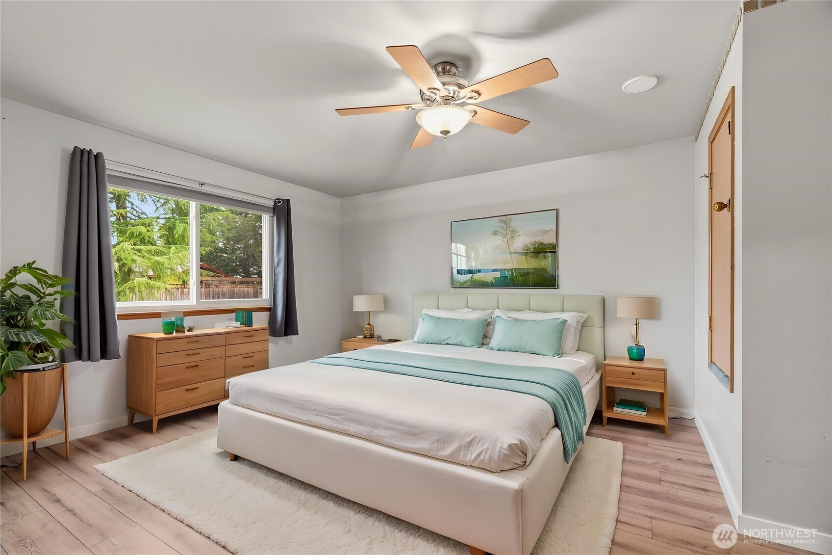 2401 185th Place Southeast Bothell, WA 98012 - Photo 32 of 36 a spacious bedroom with a large bed and a window