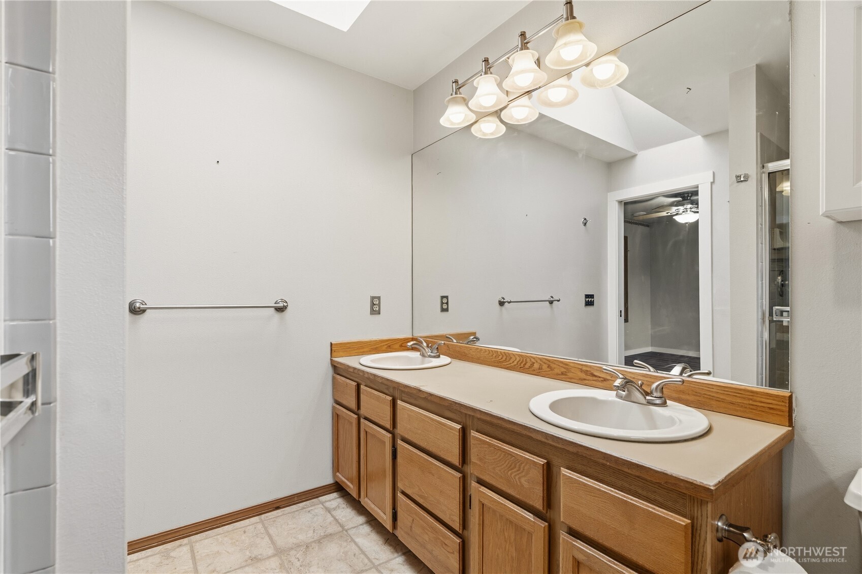 2401 185th Place Southeast Bothell, WA 98012 - Photo 36 of 36 a bathroom with a sink and a mirror