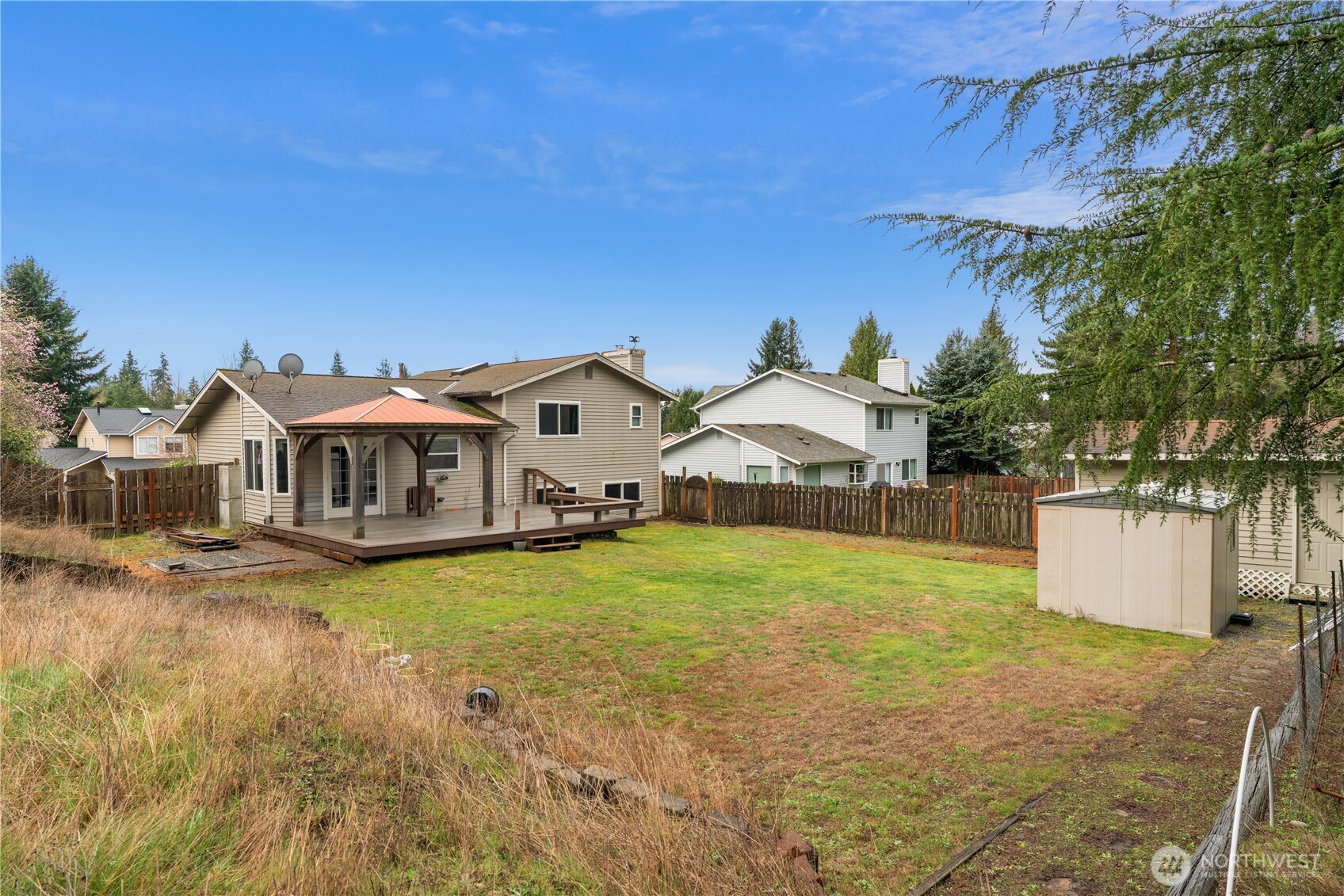 2401 185th Place Southeast Bothell, WA 98012 - Photo 6 of 36 a front view of a house with garden