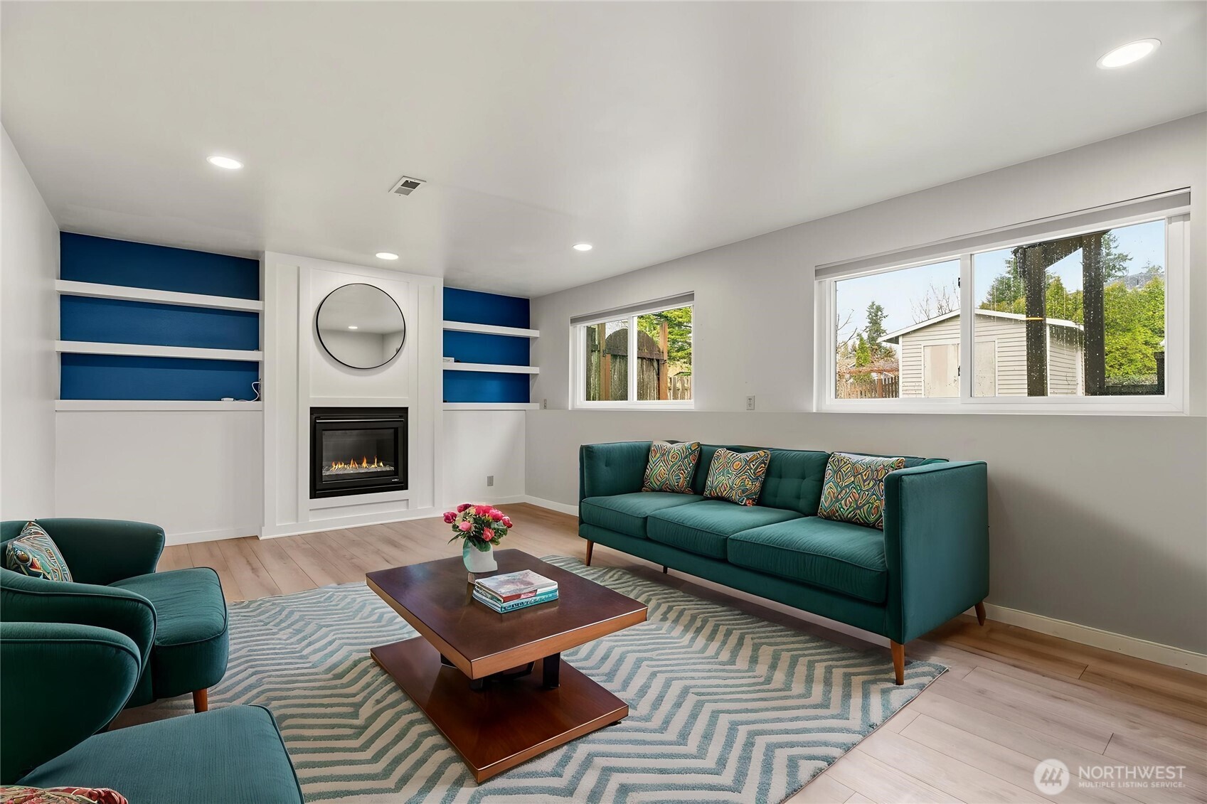 2401 185th Place Southeast Bothell, WA 98012 - Photo 10 of 36 a living room with furniture a fireplace and window