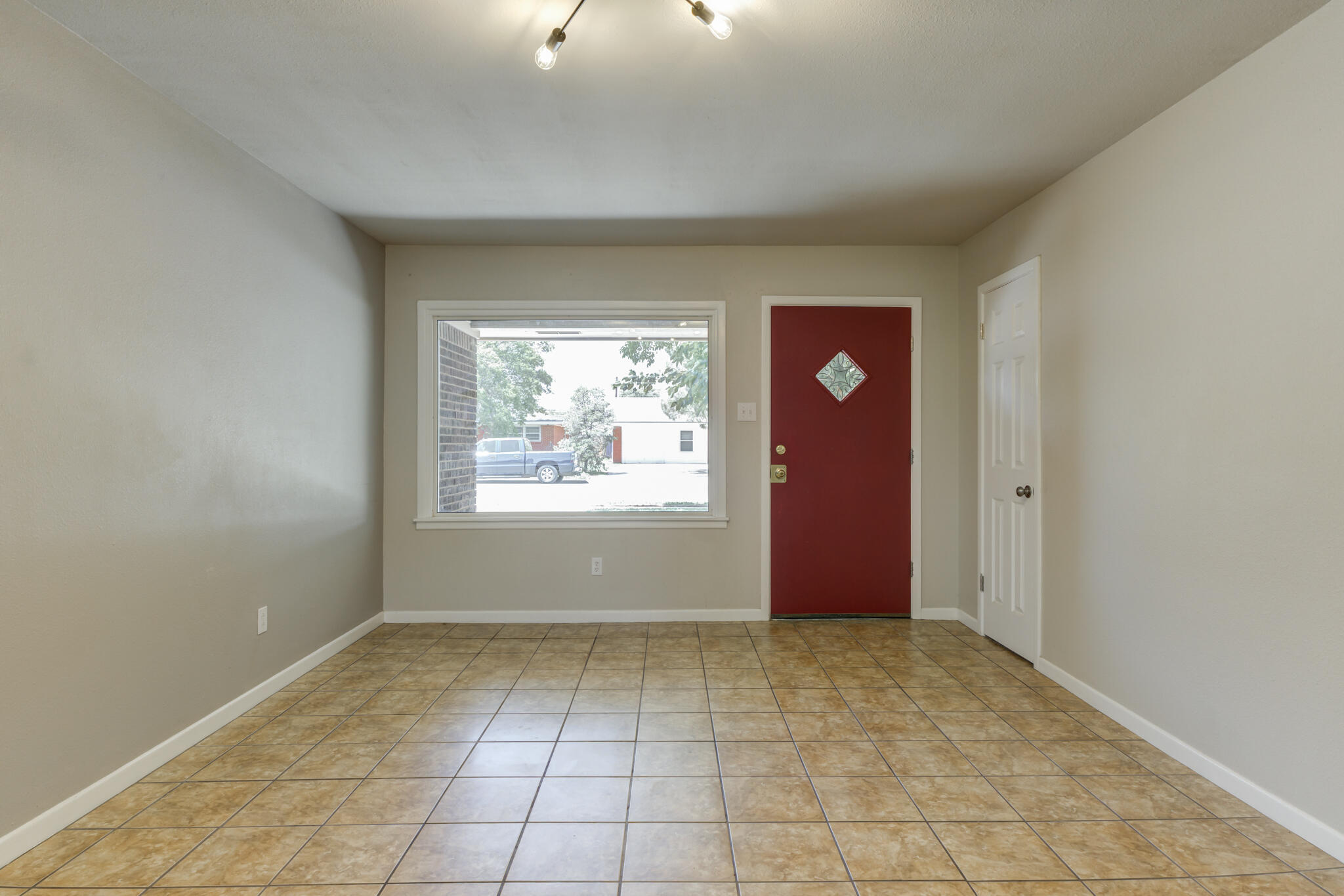 4921 10th Street Lubbock, TX 79416 - Photo 12 of 29 an empty room with windows