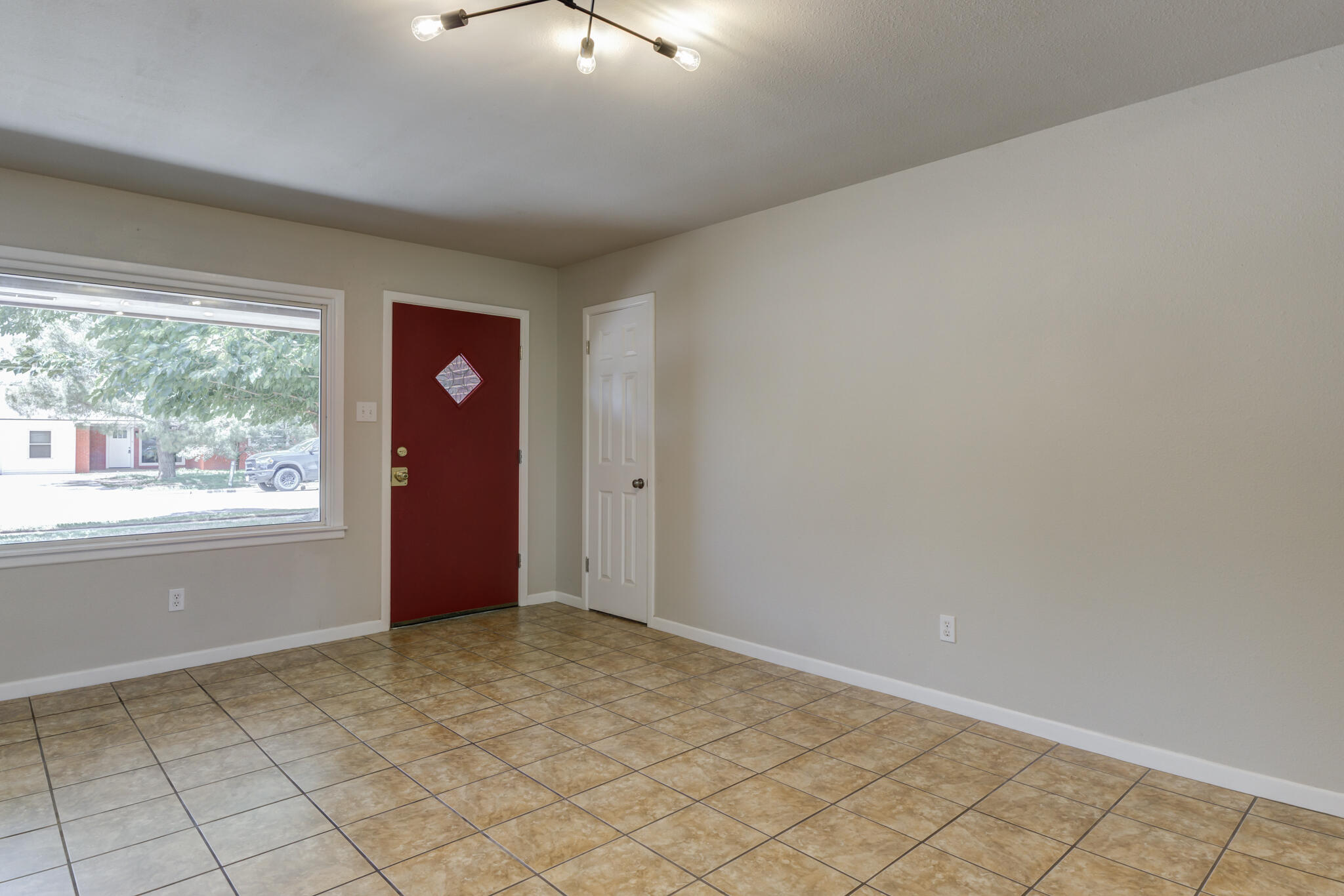 4921 10th Street Lubbock, TX 79416 - Photo 13 of 29 an empty room with windows