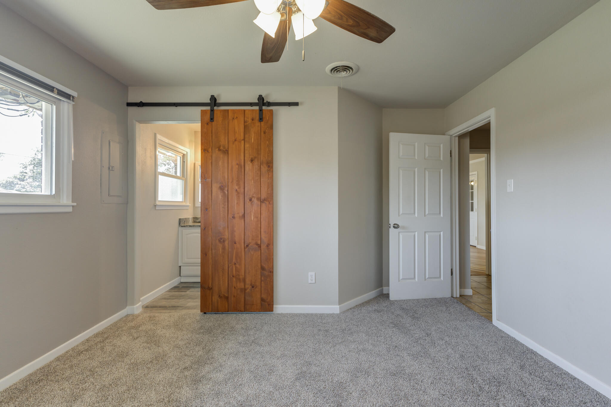 4921 10th Street Lubbock, TX 79416 - Photo 16 of 29 wooden floor in an empty room with a window