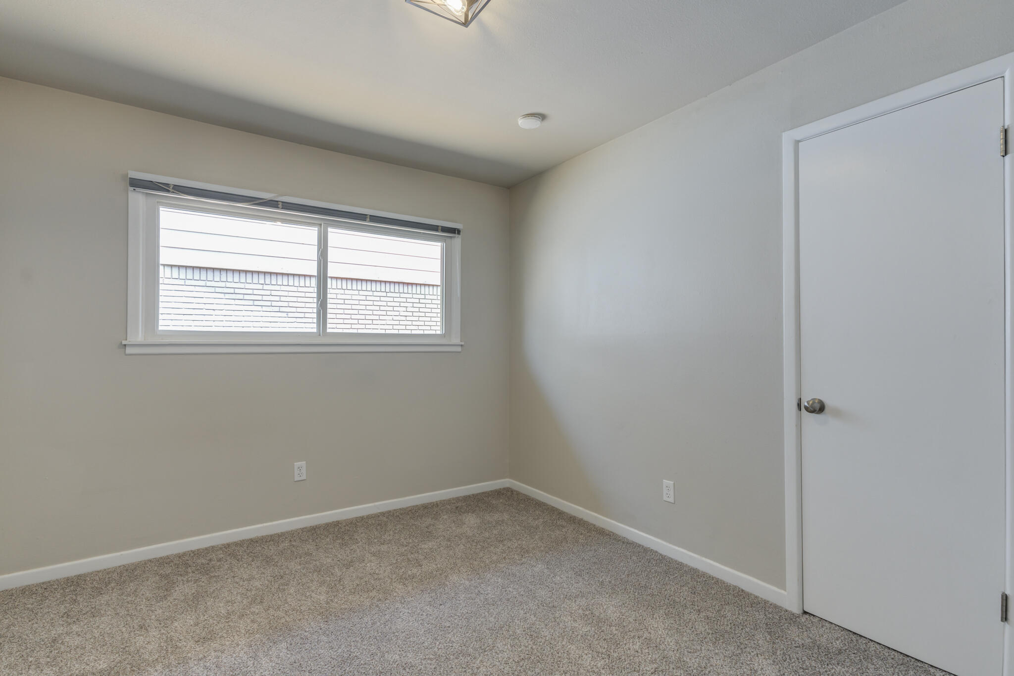 4921 10th Street Lubbock, TX 79416 - Photo 24 of 29 an empty room with a window
