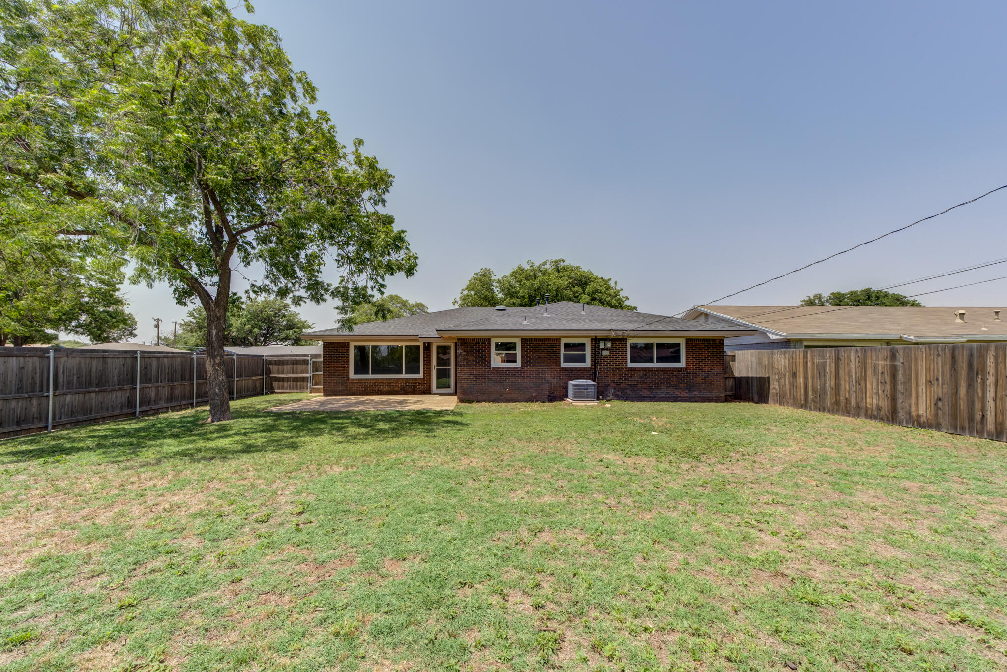 4921 10th Street Lubbock, TX 79416 - Photo 27 of 29 a view of a yard in front of a house