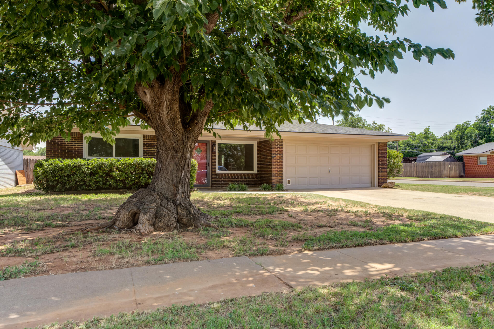 4921 10th Street Lubbock, TX 79416 - Photo 29 of 29 a front view of a house with garden