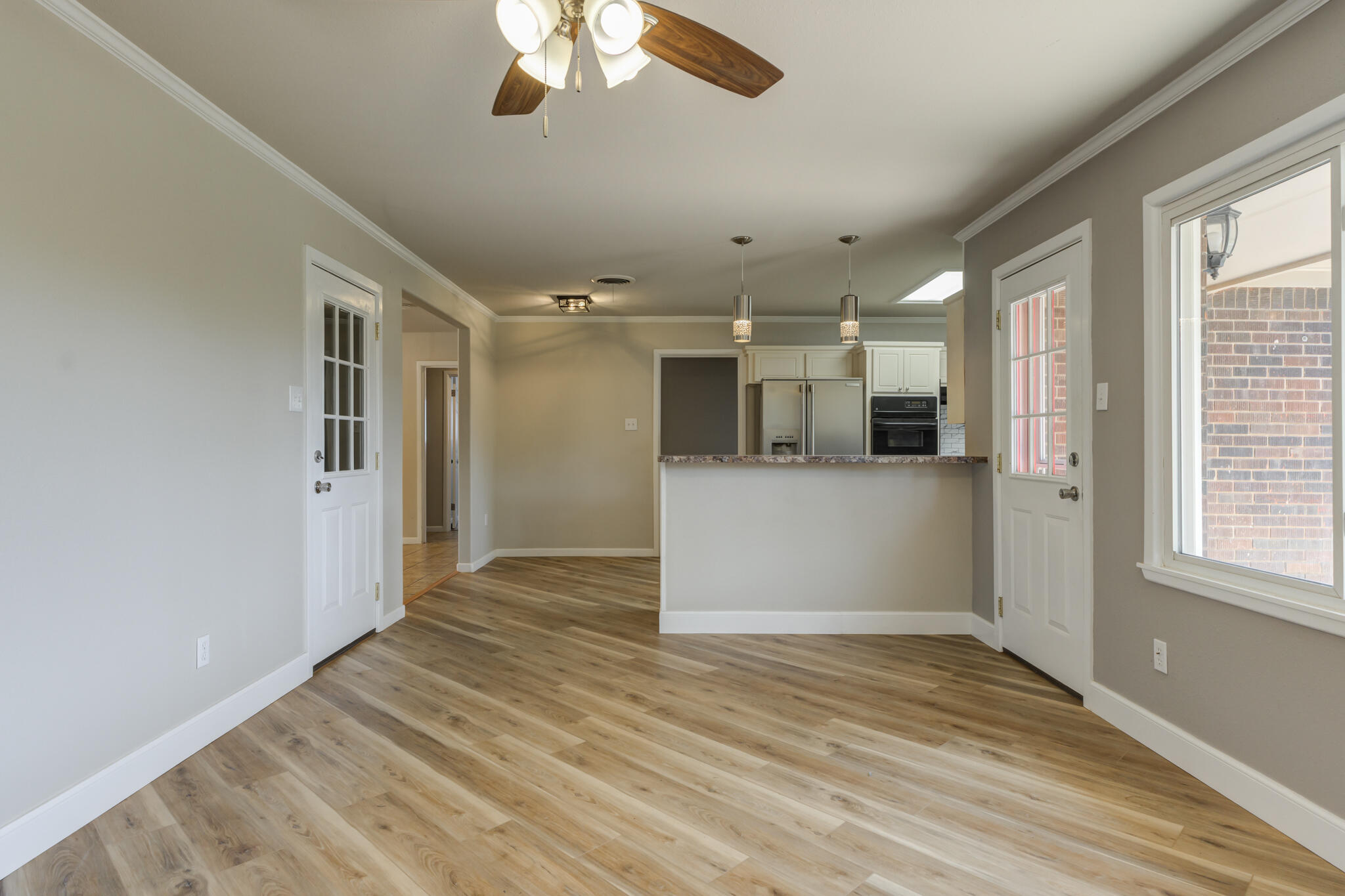 4921 10th Street Lubbock, TX 79416 - Photo 6 of 29 a view of a kitchen with a sink and cabinets