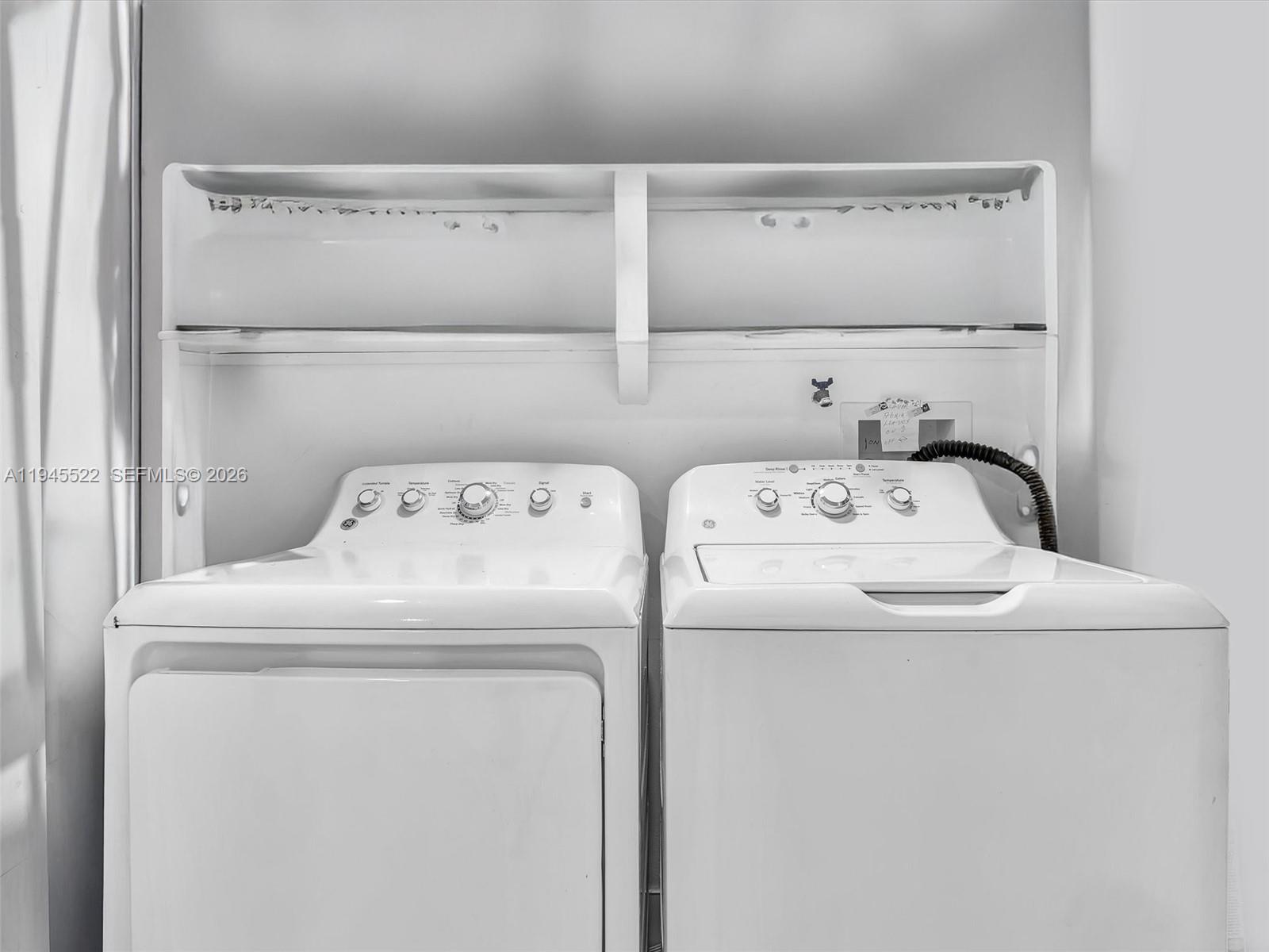 1750 West 46th Street, Unit 404 Hialeah, FL 33012 - Photo 13 of 42 a utility room with dryer and washer