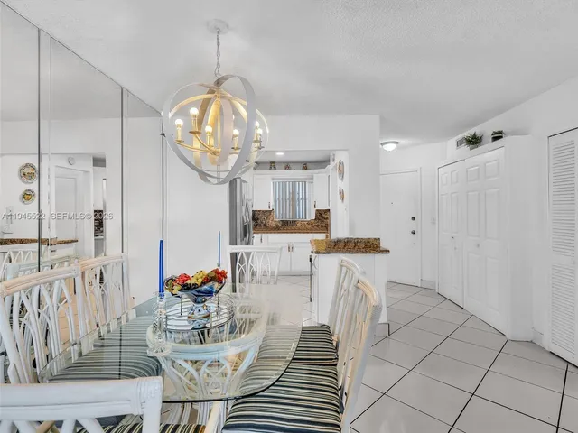 a bathroom with a toilet sink vanity and mirror