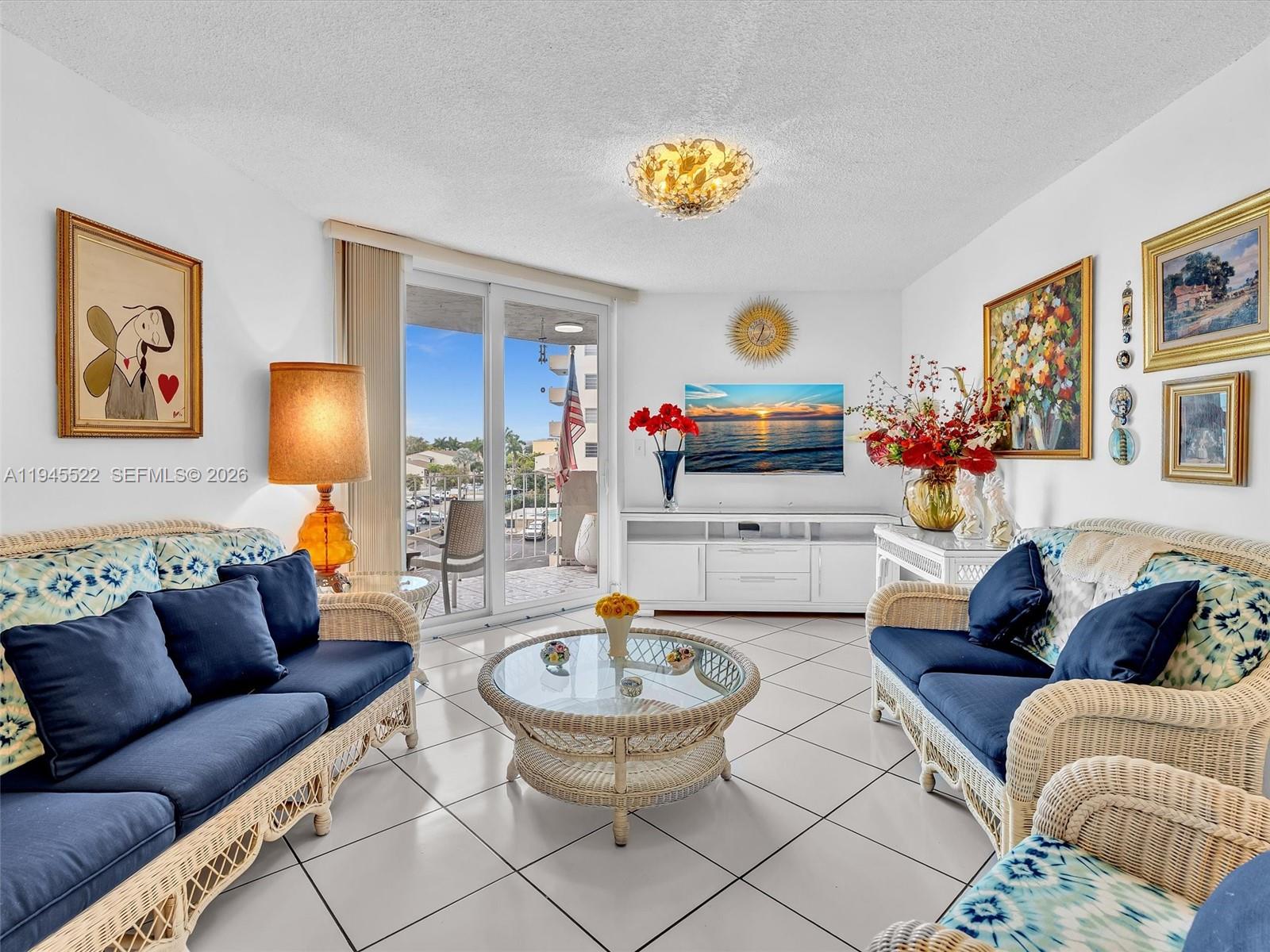 1750 West 46th Street, Unit 404 Hialeah, FL 33012 - Photo 22 of 42 a living room with furniture and painting on the wall