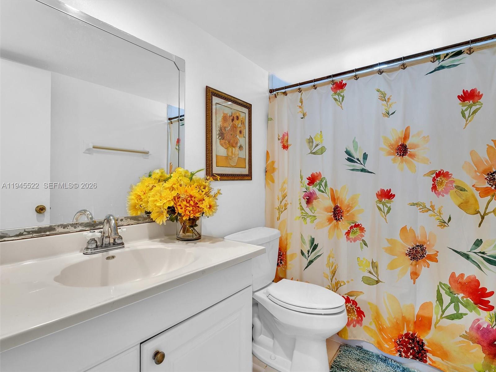 1750 West 46th Street, Unit 404 Hialeah, FL 33012 - Photo 31 of 42 a bathroom with a sink and a mirror