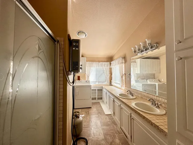 a kitchen with a sink stove and refrigerator