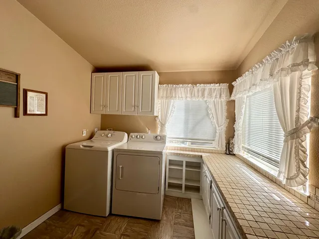 a utility room with dryer and washer