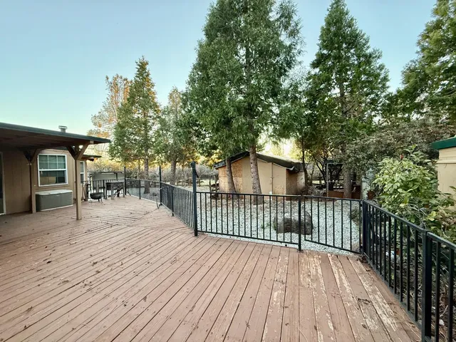 a view of a dinning table and chairs in patio of the house