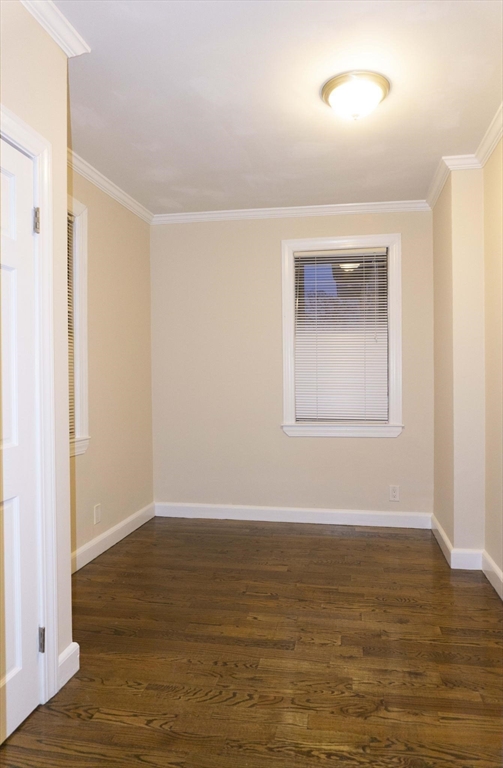 75 Elm Street Watertown, MA 02472 - Photo 11 of 12 a view of an empty room with wooden floor