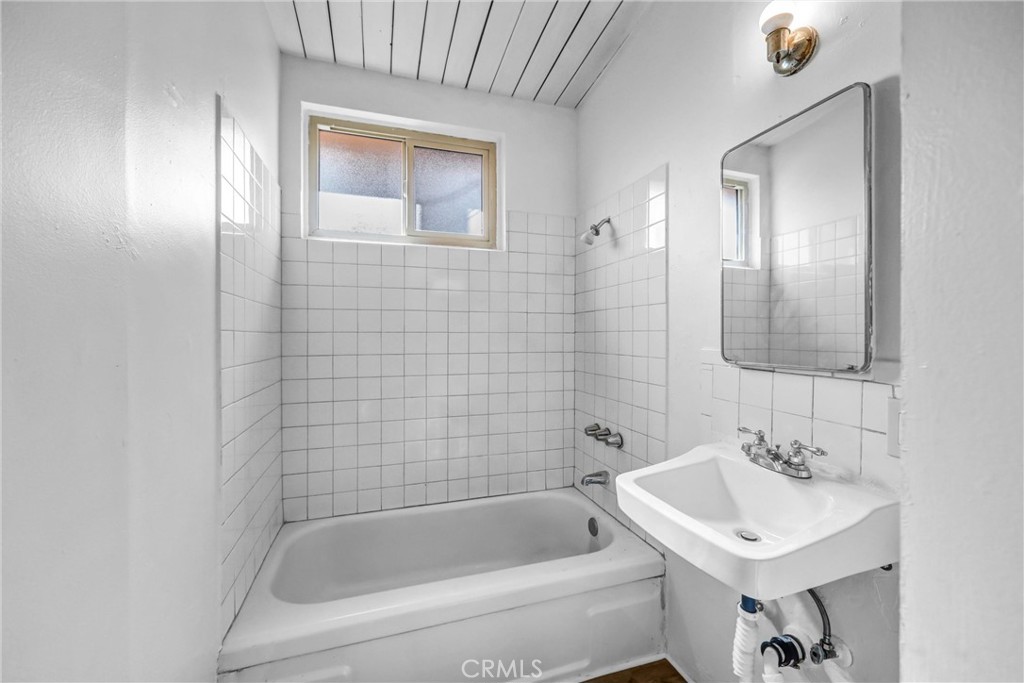 3622 East Colorado Boulevard, Unit 5 Pasadena, CA 91107 - Photo 6 of 12 a bathroom with a sink a toilet and shower