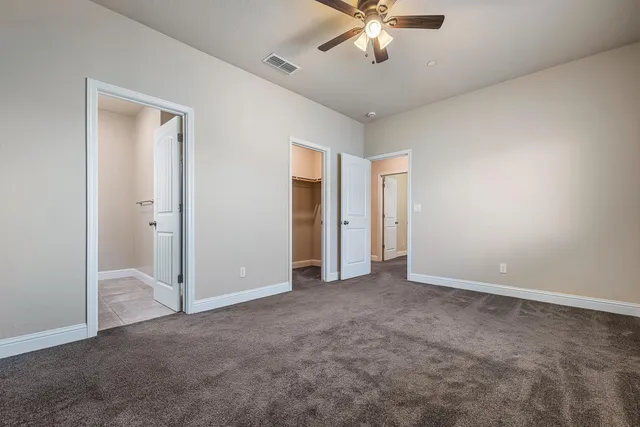 a view of a livingroom with a ceiling fan